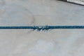 Worn blue rope on a moored ferry.. Royalty Free Stock Photo