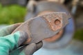 Worn brake pad in hands,auto mechanic holds a worn rusty brake pad of a car in his hands Royalty Free Stock Photo