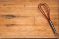 Worn Butcher Block Cutting Board with Wire Whisk Royalty Free Stock Photo