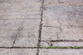 Worn and cracked asphalt with big cracks. Old road concrete texture with cracks. Cement cracked background Royalty Free Stock Photo