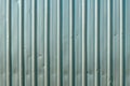 Worn damaged corrugated metal sheet texture Royalty Free Stock Photo