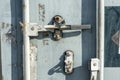 The worn door handle lock of an intermodal shipping container