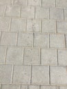 Worn footpath walk textured , gray brick block floor. Grey brown rectangle shape clay tile floor pattern, brick pavement Royalty Free Stock Photo