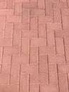 Worn footpath walk textured , red brick block floor. Red brown rectangle shape clay tile floor pattern, brick pavement background Royalty Free Stock Photo