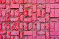 Worn footpath walk textured in red brick blocks floor above view. Red rectangle shape clay tile floor pattern. Clay brick pavement