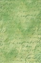 A time-worn green sheet of paper with a handwritten handwriting on it.Texture or background Royalty Free Stock Photo