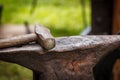 Worn iron anvil and hammer Royalty Free Stock Photo