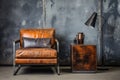 a worn leather armchair beside a steel side table