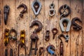 Obsolete rusty industrial hooks on shed wall