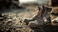 Worn military boots with dog tag on rocky ground Royalty Free Stock Photo