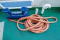 Worn mooring bollard with heavy ropes on the deck of a ship, closeup. Top view. Royalty Free Stock Photo