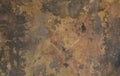 A worn, old, concrete wall with damage. Dark gray background. Non-uniform texture Royalty Free Stock Photo