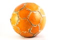 Worn orange soccer ball