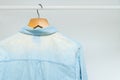 Worn out, bleached out old classic business shirt hanging in a w Royalty Free Stock Photo