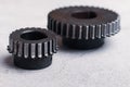 Worn out chipped gears that need to replace because teeth damaged due to heavy grinding put by small size at front Royalty Free Stock Photo