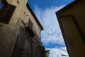 Worn out facade of a building with balconies and a cloudy sky as background Royalty Free Stock Photo