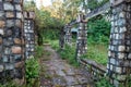 Worn out outdoor park with remains of stone walls and walk-throughs. India