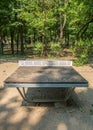 Worn out ping pong tables in Herestrau park, Bucharest.. Outdoor metal tables for tennis Royalty Free Stock Photo