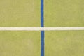 Worn out plastic hairy carpet on outside hanball court. Floor with colorful marking lines. Royalty Free Stock Photo