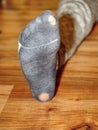 Worn out socks with holes and toes sticking out