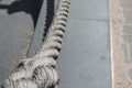 worn out thick mooring rope on pier