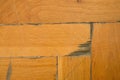 Worn out wooden floor of sports hall. Light wood flooring worned by use and time