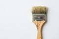 Worn paint brush on a light background. Space for text. Royalty Free Stock Photo