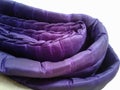 A worn purple blanket on the box