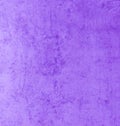 A worn purple concrete wall with scratches and stains. Purple background with texture. The old wall