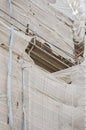 Worn and ripped sheet covering scaffolding in a construction site in Budapest, Hungary, Europe. Reconstructing and repairing a Royalty Free Stock Photo