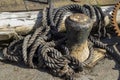 Worn rope and metal mooring post Royalty Free Stock Photo