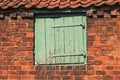 Worn Small Wooden Door set in Old Bricks Royalty Free Stock Photo