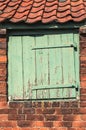 Worn Small Wooden Door set in Old Bricks Royalty Free Stock Photo