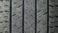 Worn tire texture. Change time. Tire tread problems and solutions concept. Old damaged, worn black tire