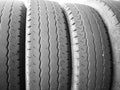 worn tyres stacked side by side sidelit