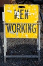 Weathered MEN WORKING sign