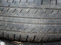 Worn winter tires. Mechanic checks the old and worn out tires at the garage before traveling long distances in the winter and