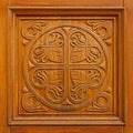 Worn wood panel with carved floral design Royalty Free Stock Photo