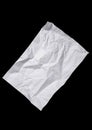 Worn and wrinkled white paper sheet isolated on black background Royalty Free Stock Photo