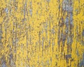 Worn yellow paint on metal sheet texture