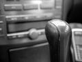 Worned , leather gear shift knob close up in car interior Royalty Free Stock Photo
