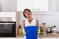 Woman Holding Bucket While Water Droplets Leak From Ceiling Royalty Free Stock Photo