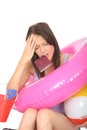 Worried Anxious Stressed Young Woman Holding a Passport with Holiday Items