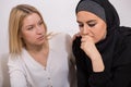 Worried arab woman with friend