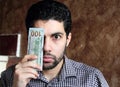 Worried arab young businessman with dollar bills money Royalty Free Stock Photo