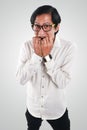 Worried Asian Businessman in Scared Gesture