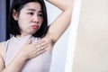 Asian woman having skin problem underarm with black or dark wrinkle armpits Royalty Free Stock Photo