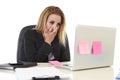 Worried attractive businesswoman in stress working with laptop c Royalty Free Stock Photo