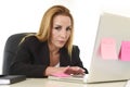 Worried attractive businesswoman in stress working with laptop c