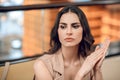 Beautiful young woman looking waiting and looking worried